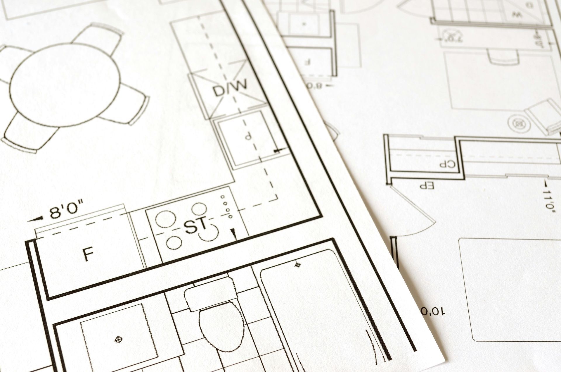 Architectural blueprints showing kitchen and dining area layout.